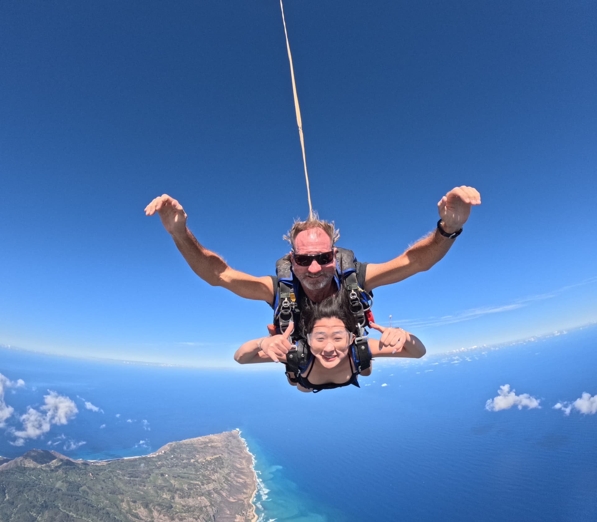 Josephine skydiving over the Hawaiian coastline