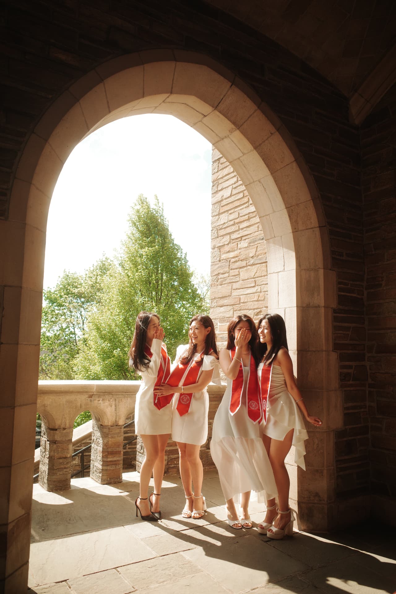 Josephine and friends in Cornell graduation stoles